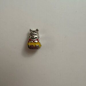 Retired out of stock Winnie the Pooh with honeypot charm.